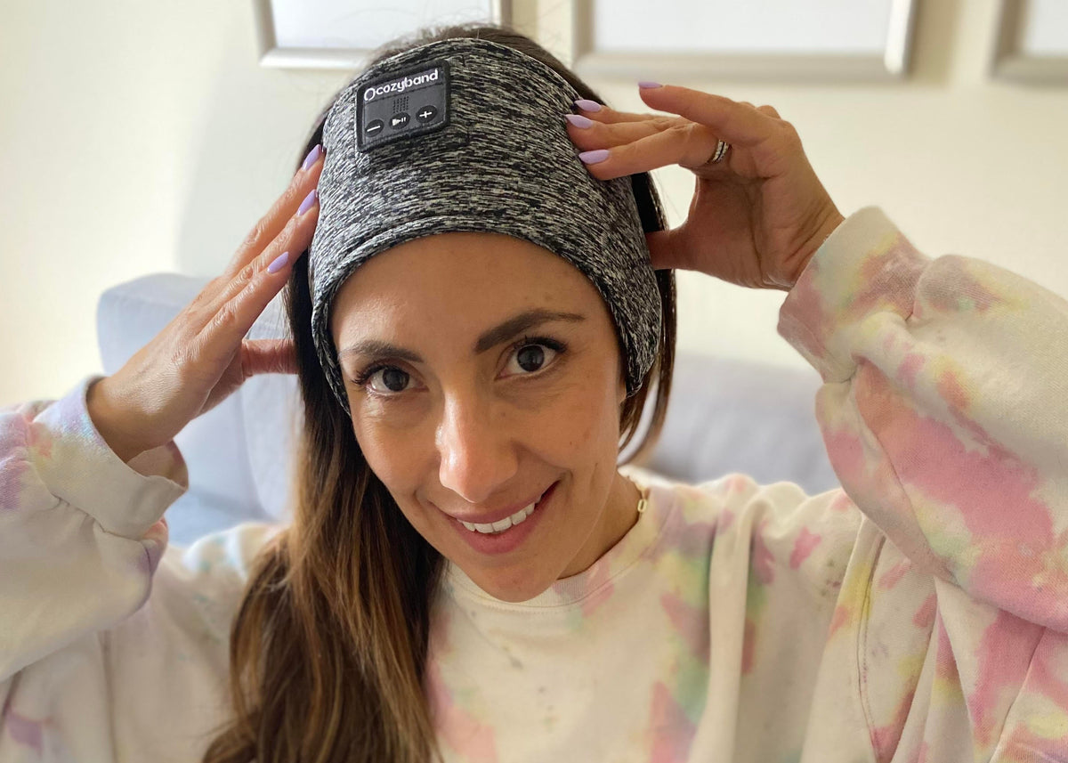 Woman wearing CozyBand in bed